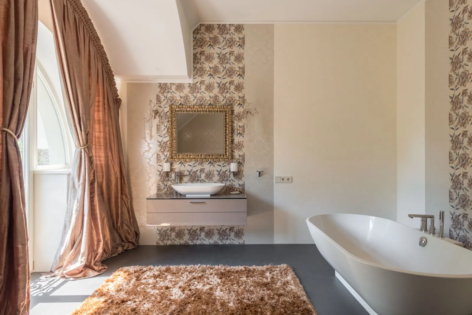 An elegant restored period bathroom with a freestanding bath